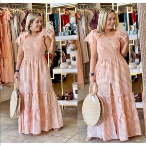 SIZE SMALL LONG ORANGE DRESS WITH SLIT ON SIDE AND POMPOMS ATTACHED NEVER WORN